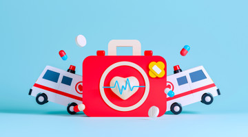 Speelgoed EHBO-koffer met een hart en een polsgrafiek, omringd door speelgoedambulances en pillen op een blauwe achtergrond.